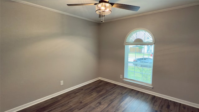 empty room with ceiling fan, dark hardwood / wood-style floors, and ornamental molding