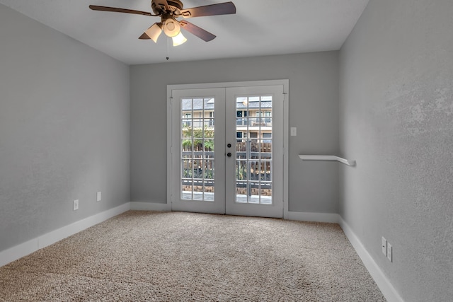 spare room featuring ceiling fan, french doors, and carpet floors