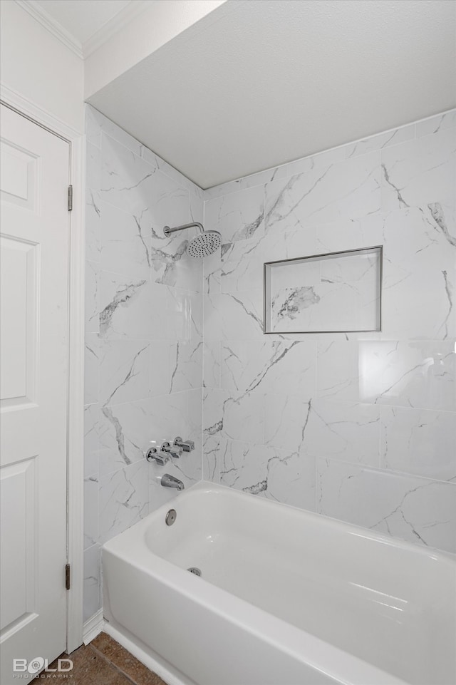 bathroom featuring tile patterned flooring and tiled shower / bath combo