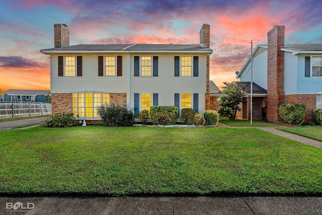 view of front of home featuring a lawn