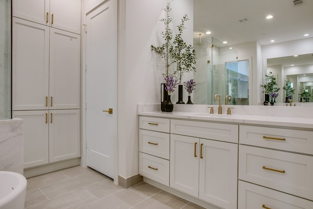 bathroom with tile patterned flooring, vanity, and independent shower and bath