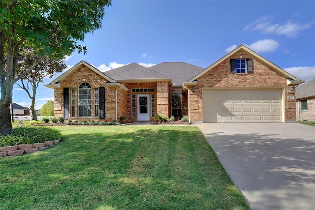 view of front facade featuring a garage and a front lawn