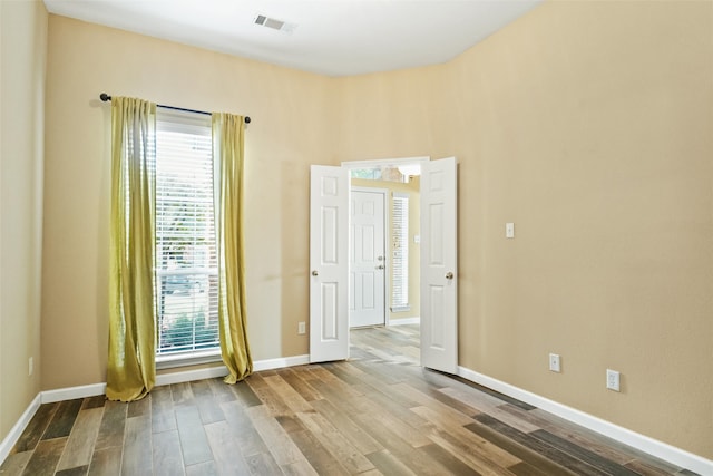 spare room featuring hardwood / wood-style flooring