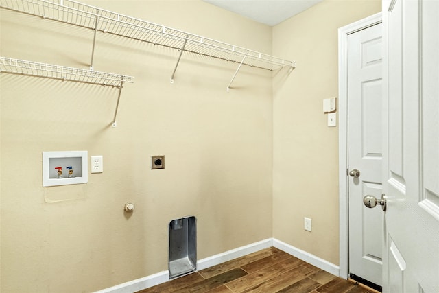 laundry room with gas dryer hookup, electric dryer hookup, hardwood / wood-style flooring, and washer hookup