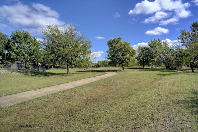 view of property's community featuring a yard