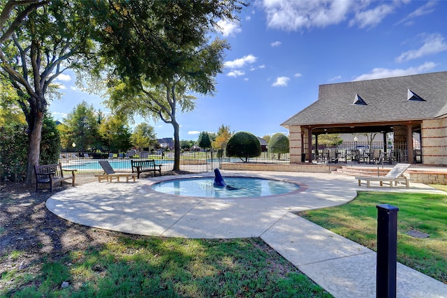 view of pool with a yard and a patio