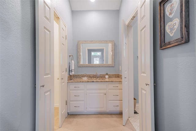 207 King Laurence Ct, Scroggins, TX 75480 - bathroom featuring vanity and a textured wall