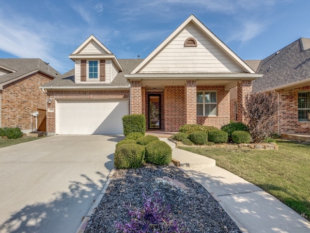 view of front of home featuring a front lawn and a garage