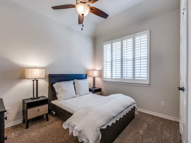 bedroom featuring dark colored carpet and ceiling fan