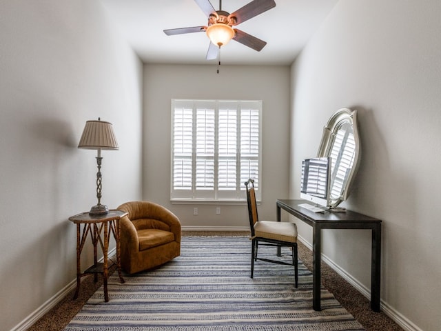 sitting room featuring carpet and ceiling fan