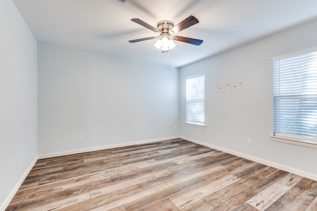 unfurnished room with ceiling fan and light hardwood / wood-style flooring