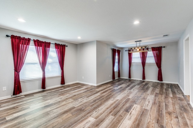 spare room featuring hardwood / wood-style floors