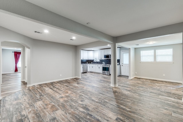 unfurnished living room with light hardwood / wood-style floors