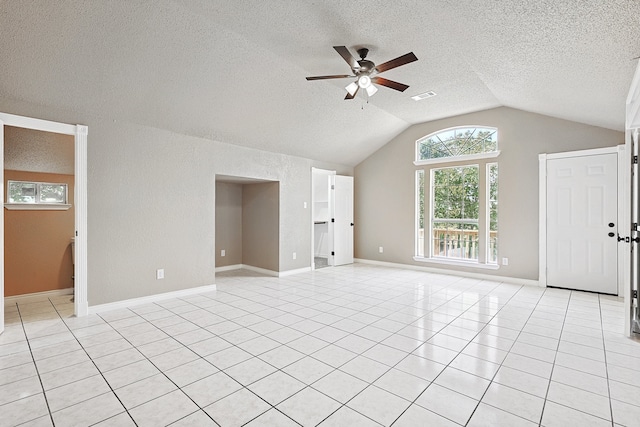 unfurnished living room with a ceiling fan, visible vents, vaulted ceiling, and light tile patterned floors