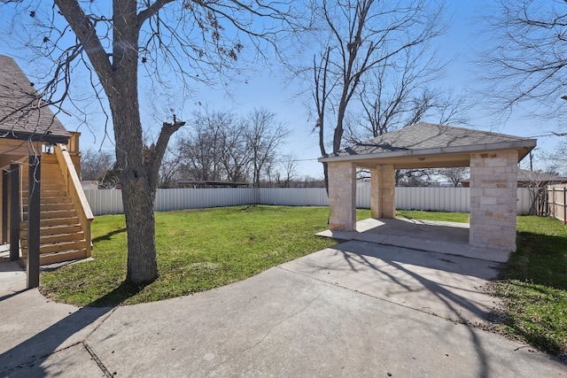 view of yard featuring a fenced backyard, a patio, and a gazebo