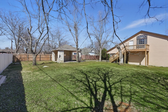 view of yard featuring an outbuilding, a storage shed, stairway, and a fenced backyard