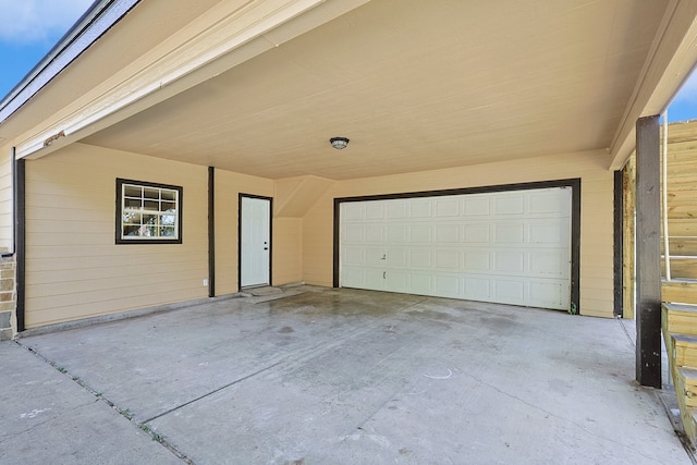 garage with concrete driveway