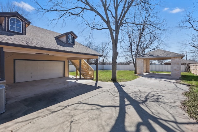 exterior space with driveway and fence