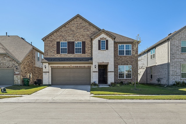 view of front of home featuring a garage and a front yard