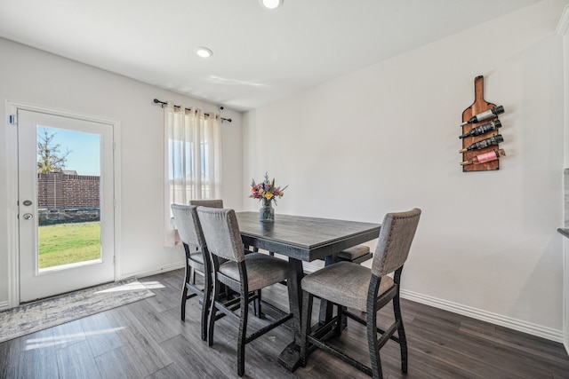 dining space featuring dark hardwood / wood-style floors