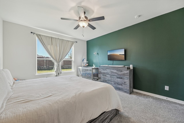 bedroom featuring light carpet and ceiling fan