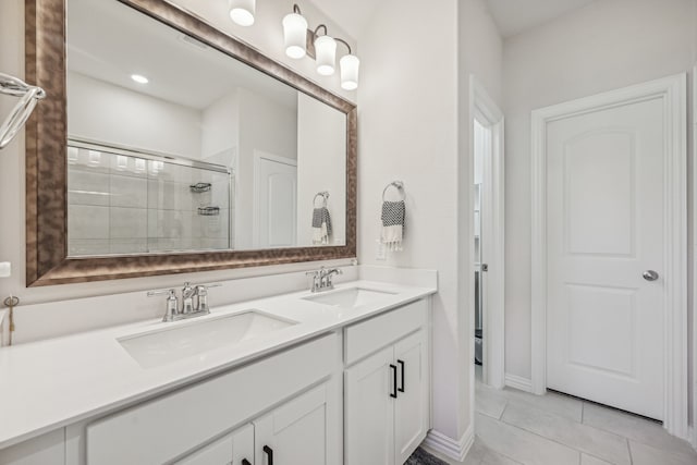 bathroom featuring walk in shower, vanity, and tile patterned floors