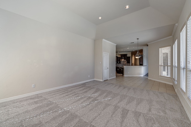 unfurnished living room featuring ornamental molding and light colored carpet