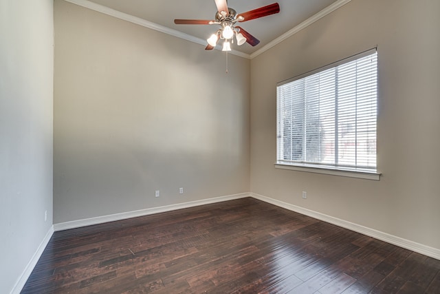 spare room featuring dark hardwood / wood-style flooring, ceiling fan, and ornamental molding