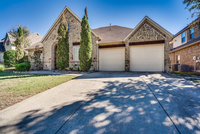 view of front of house featuring a garage and a front yard