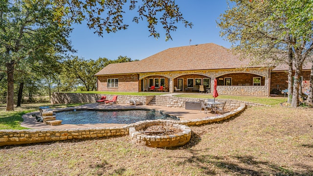 rear view of property featuring a patio