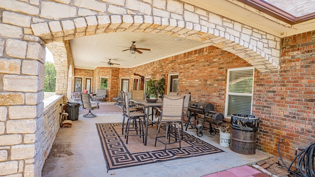 view of patio / terrace with area for grilling and ceiling fan