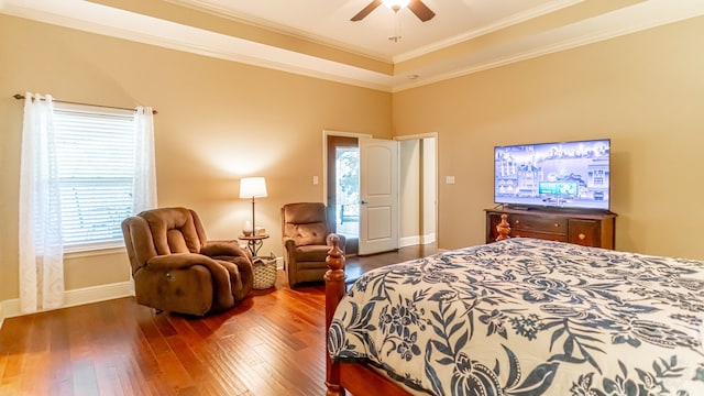 bedroom featuring ornamental molding, ceiling fan, and dark hardwood / wood-style floors