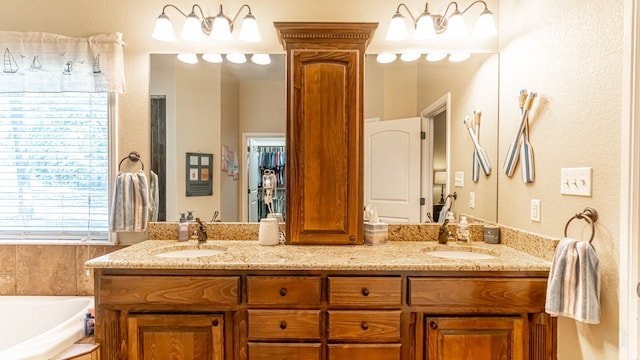 bathroom with a bathtub and vanity