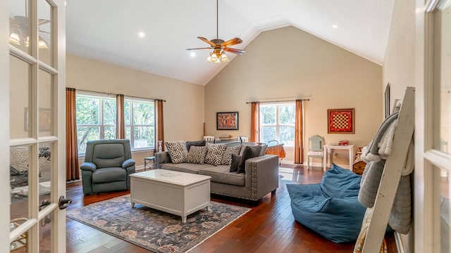 living room featuring high vaulted ceiling, dark hardwood / wood-style floors, and ceiling fan