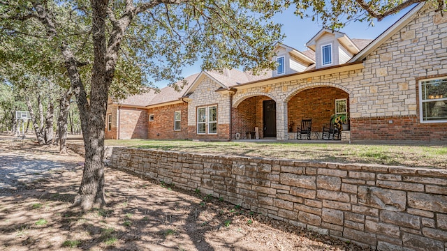 rear view of house featuring a patio