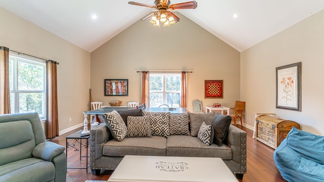 living room with ceiling fan, a wealth of natural light, and wood-type flooring