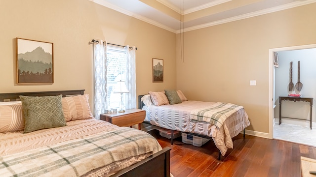 bedroom with dark hardwood / wood-style flooring and ornamental molding