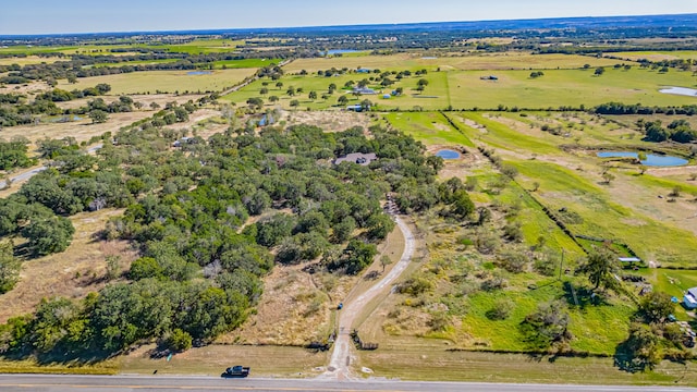 bird's eye view with a rural view and a water view