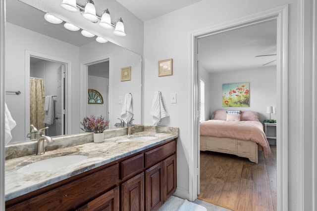 bathroom featuring vanity and hardwood / wood-style flooring