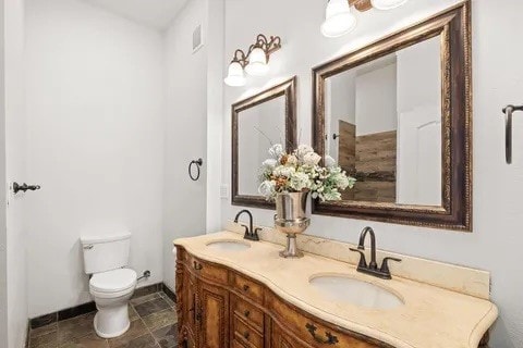 bathroom with vanity and toilet