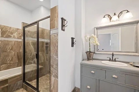 bathroom with vanity and plus walk in shower