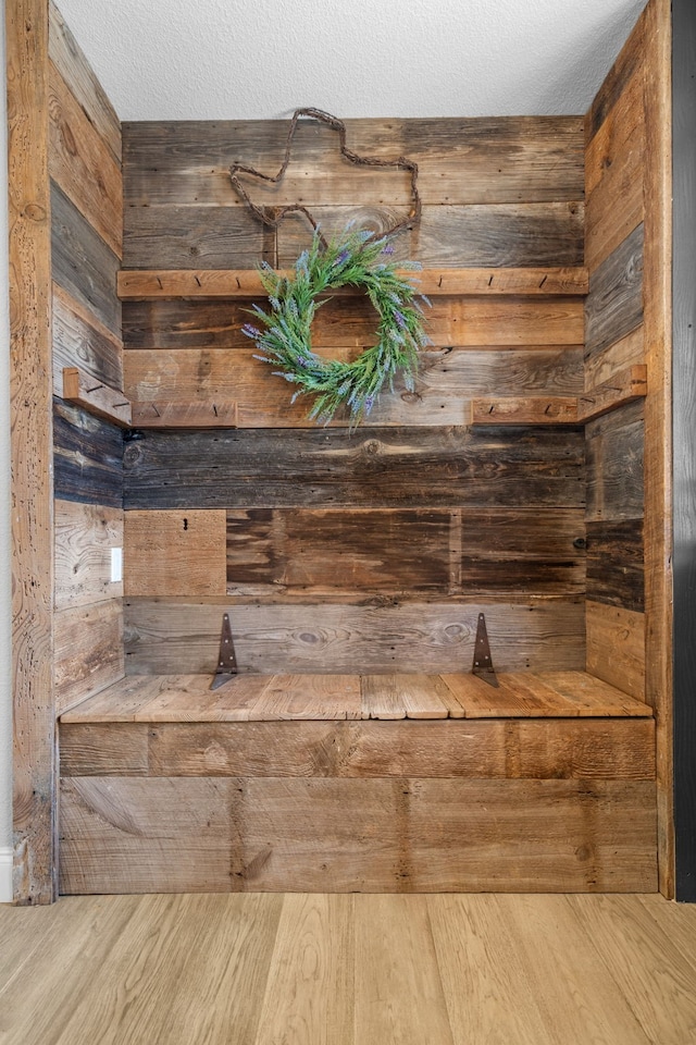 room details featuring wood-type flooring and a textured ceiling