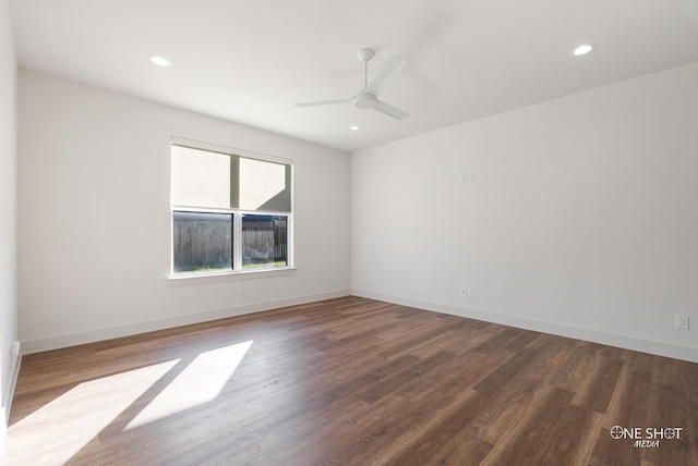 empty room featuring ceiling fan and hardwood / wood-style flooring