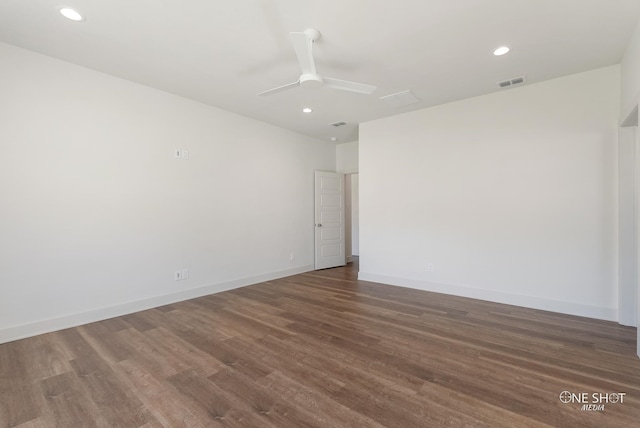 unfurnished room featuring ceiling fan and dark hardwood / wood-style floors