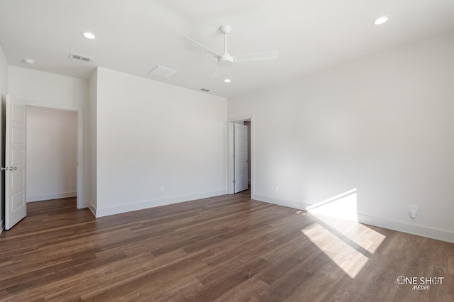 empty room with dark hardwood / wood-style floors and ceiling fan