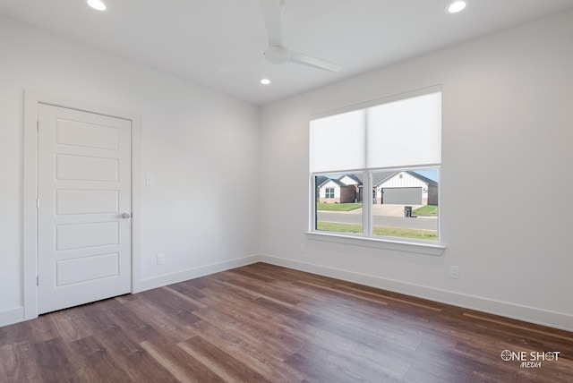 empty room featuring dark hardwood / wood-style floors and ceiling fan