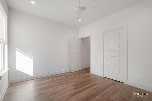 unfurnished bedroom featuring ceiling fan and hardwood / wood-style floors