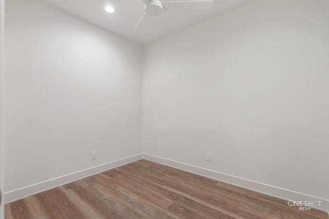 spare room with ceiling fan and wood-type flooring