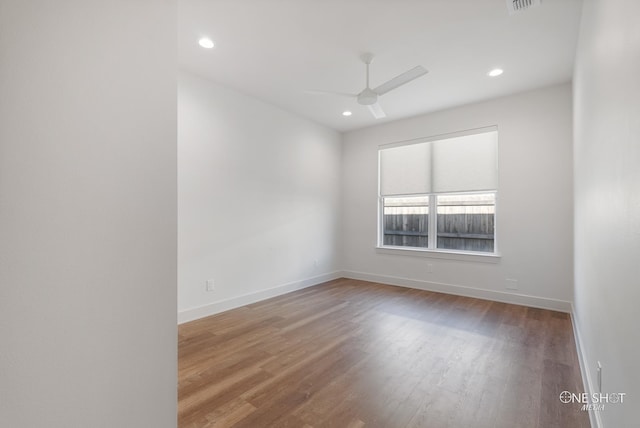 empty room featuring hardwood / wood-style flooring and ceiling fan