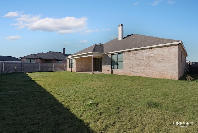 7813 Langford Dr, Abilene, TX 79606 - back of house with brick siding, a chimney, and roof with shingles